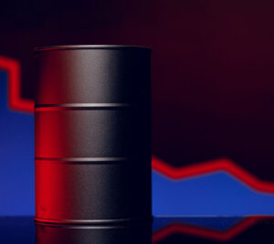 Oil barrel with a downward trending graph representing market timing considerations for selling mineral rights.