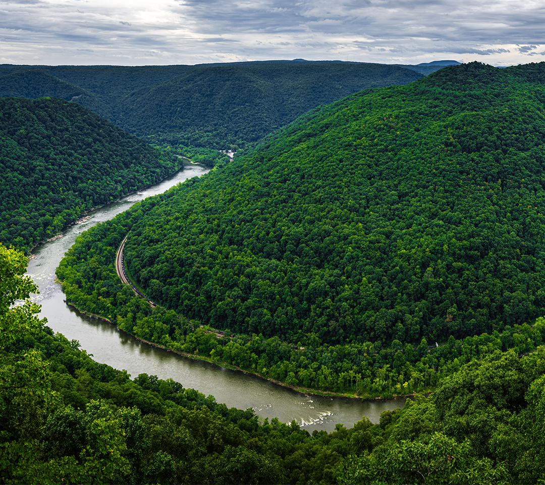 Scenic view of a river in West Virginia, surrounded by natural landscapes.