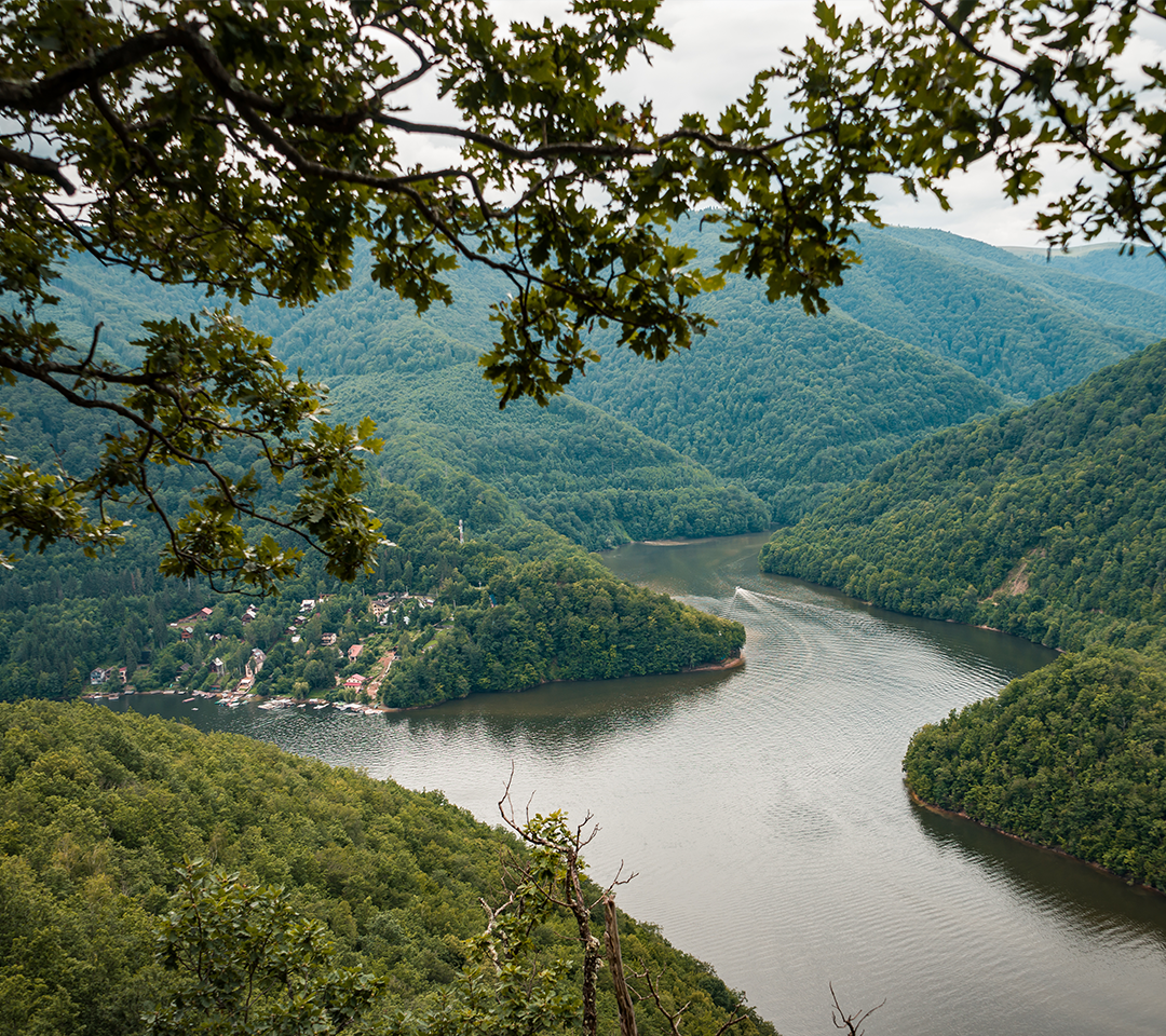 Panoramic view of a river winding through West Virginia, seen from a mountaintop.